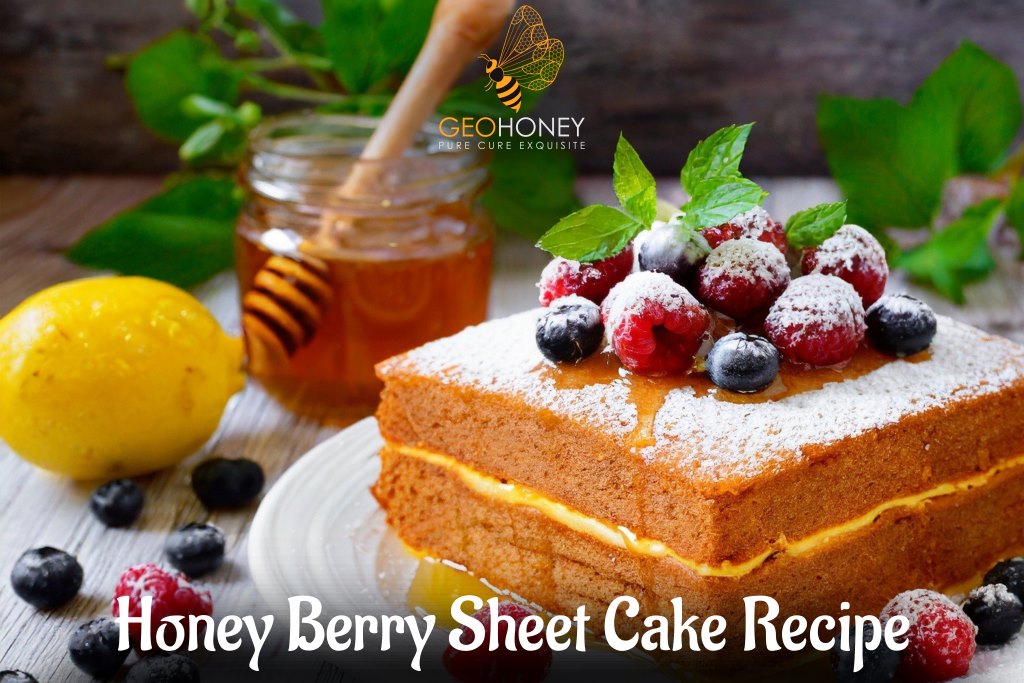 A delicious and moist honey berry sheet cake with a glaze, topped with fresh berries.