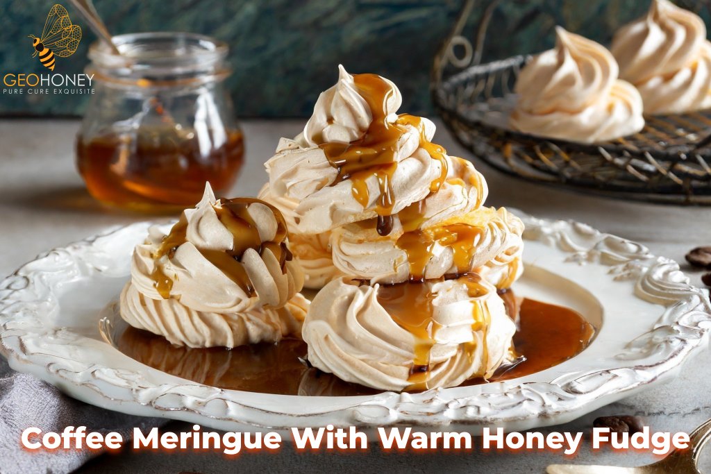 A plate of coffee meringue nests filled with creamy warm honey fudge, topped with a drizzle of honey fudge sauce.