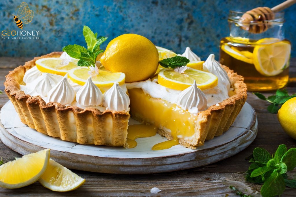 A slice of delicious Honey Lemon Meringue Pie with a graham cracker crust, creamy lemon filling made with sweetened condensed milk.